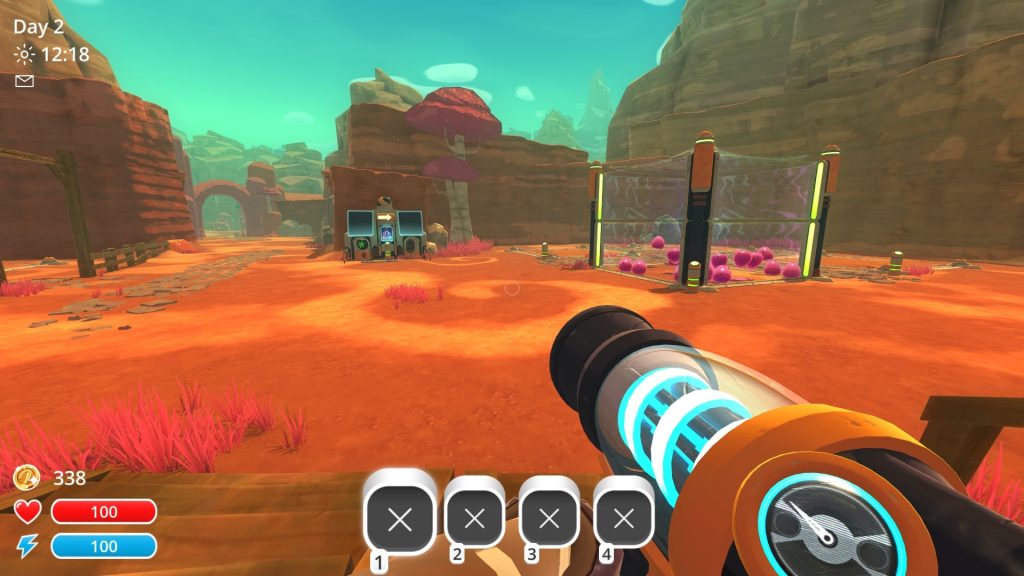 "slime breeder" screenshot showing your ranch as seen from the gate, mostly empty except for a corral filled with pink slime.