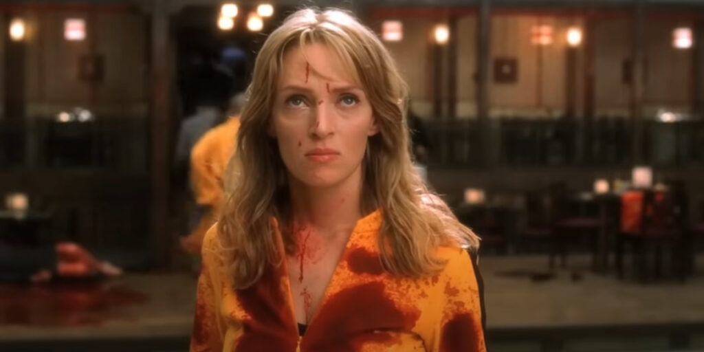 A blood-soaked Uma Thurman looks up defiantly in Kill Bill: Vol. 1.