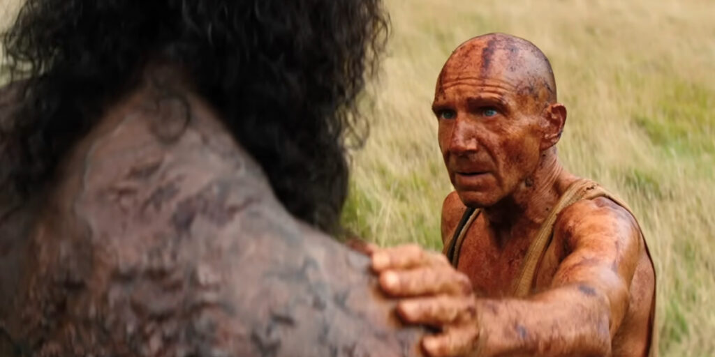 Ralph Fiennes cautiously puts his had on Chi Lewis-Parry's shoulder in 28 Years Later: The Bone Temple.