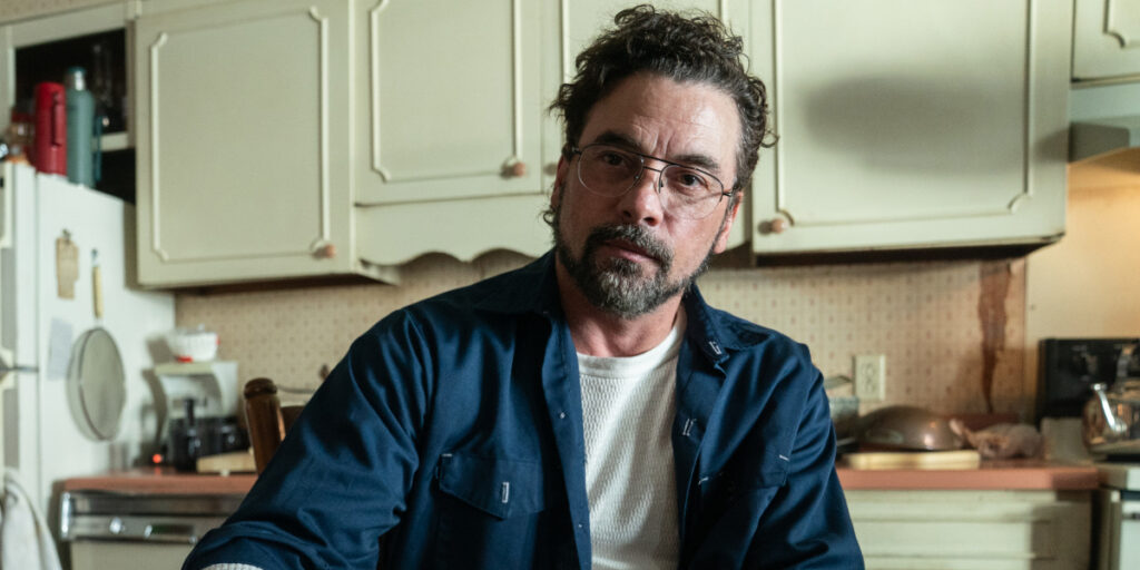 Skeet Ulrich sits wearily at his kitchen table in Five Nights At Freddy's 2.