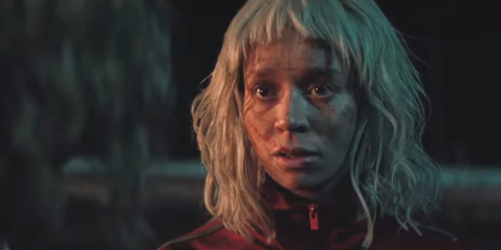 Erin Kellyman looks frightened in the firelight in 28 Years Later: The Bone Temple.