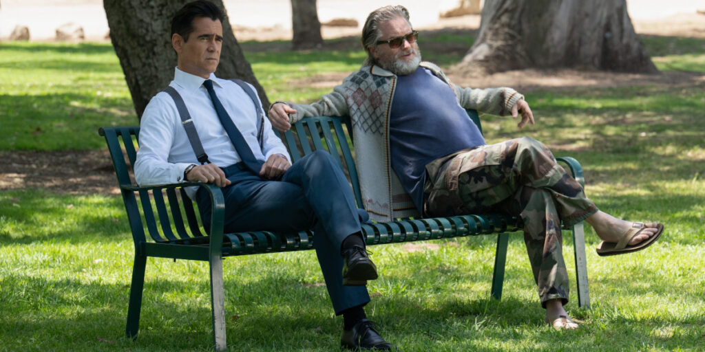 Colin Farrell sits on a bench chatting with a low key Shea Whigham in Sugar Season 2.