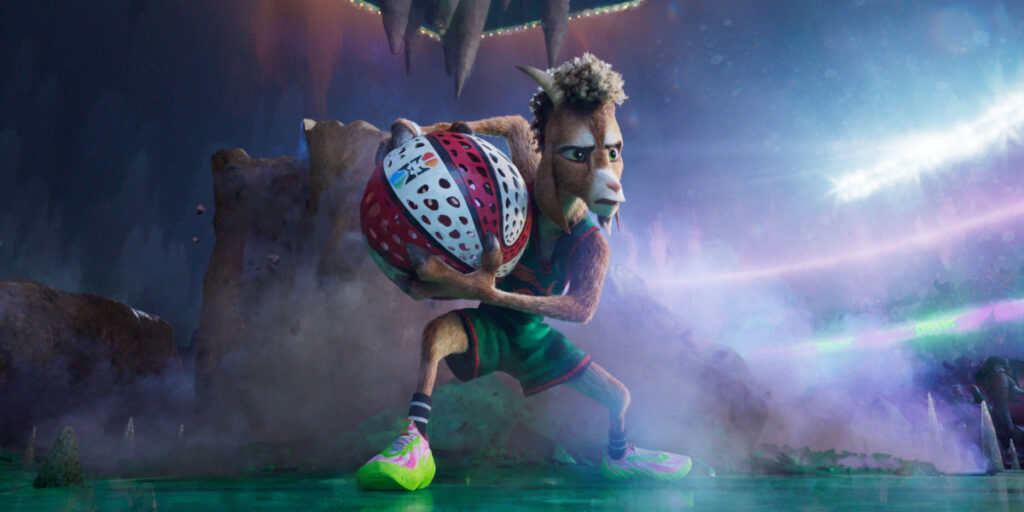 Will stands holding the ball on the court with determination in Goat.