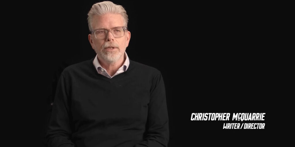 Christopher McQuarrie sits talking in a featurette for Mission Impossible: The Final Reckoning.