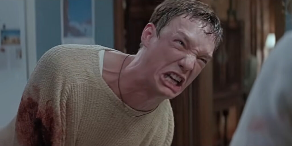 Matthew Lillard doubled over in pain after getting stabbed in Scream.