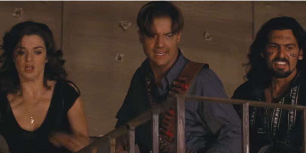 Rachel Weisz, Brendan Fraser, and Oded Fehr look on in shock in The Mummy Returns.