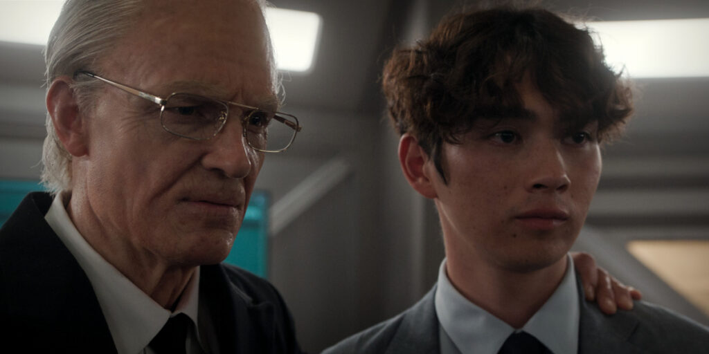 An aged up Joel Kinnaman stands with his hand on Sean Kaufman's shoulder in For All Mankind S5.