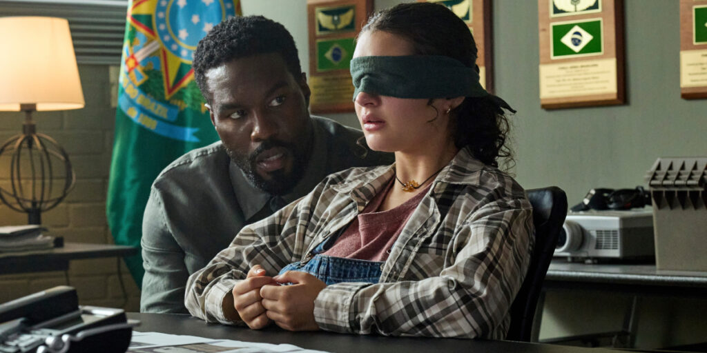 Yahya Abdul-Mateen II looms behind a blindfolded Billie Boullet in Man on Fire (2026).