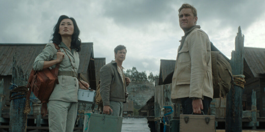 Mari Yamamoto, Anders Holm, and Wyatt Russell look ahead with curiosity in Monarch: Legacy of Monsters - S2 E1 "Cause and Effect."