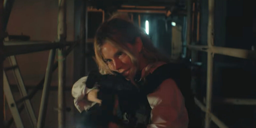 Sienna Miller storms a boat at night with her gun drawn in Tom Clancy's Jack Ryan: Ghost War.