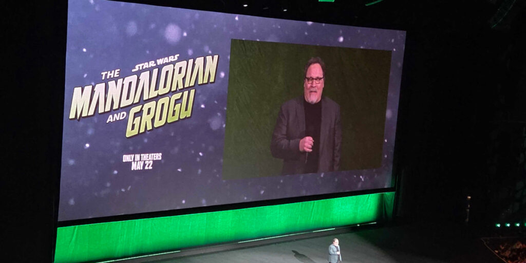 Jon Favreau presenting for The Mandalorian and Grogu at Disney's CinemaCon 2026 panel.