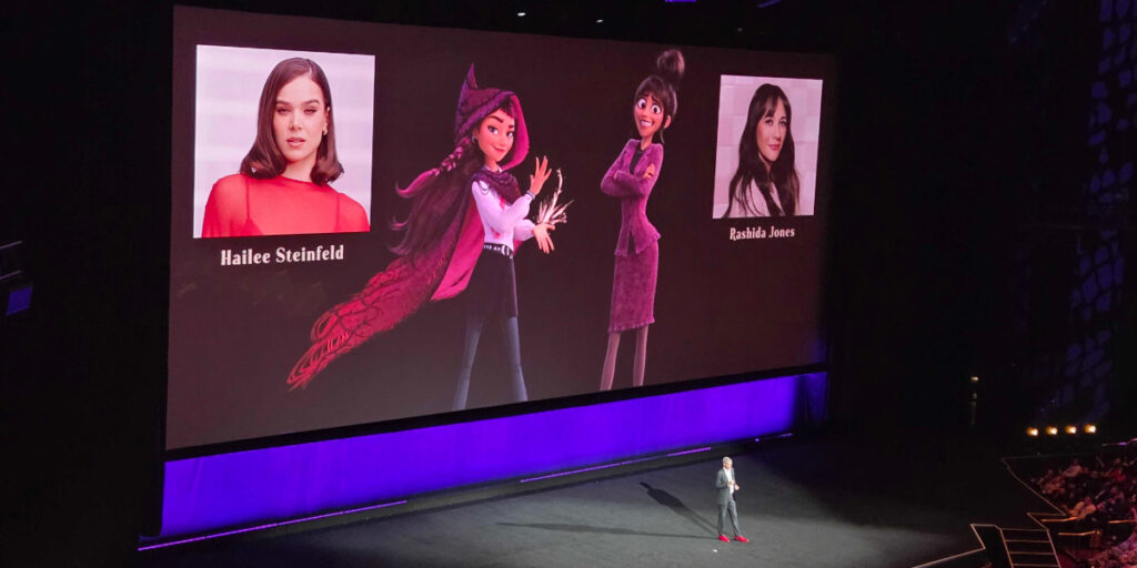 A slide featuring Hailee Steinfeld and Rashida Jones' characters from Hexed at Disney's CinemaCon 2026 panel.