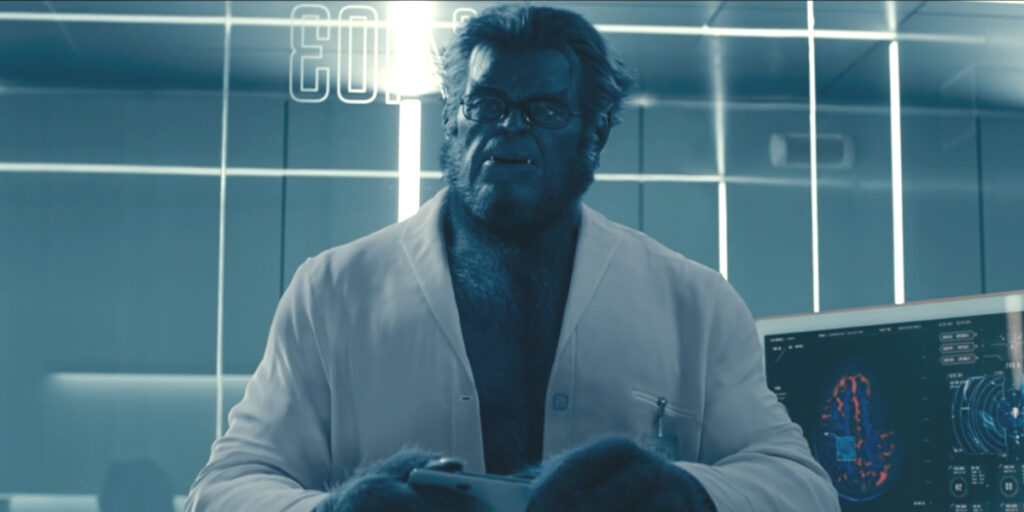 Kelsey Grammer's Beast stands in conversation in a holding room in The Marvels.