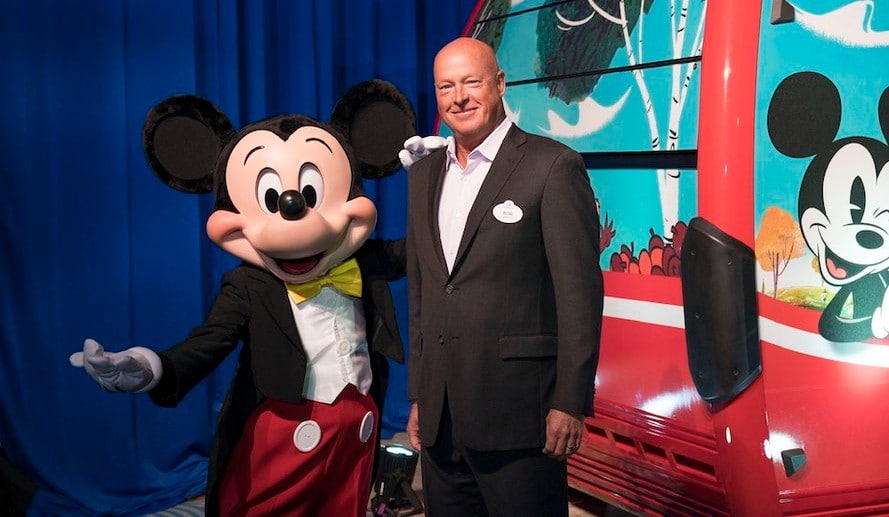 Bob Chapek also posing with Mickey Mouse.