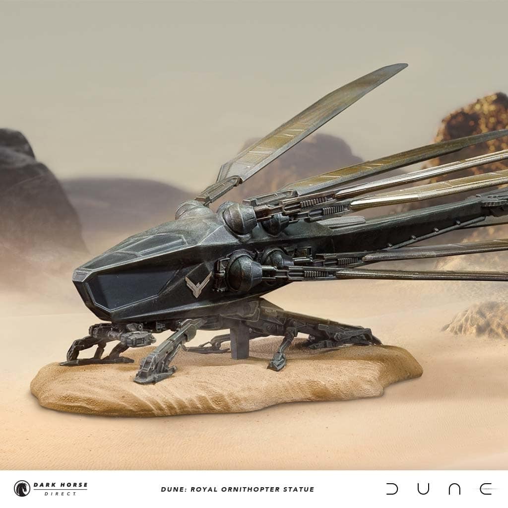 Royal Ornithopter Statue posed against a desert background.