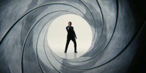 A slightly obscured Daniel Craig draws his gun in the opening gun barrel for No Time To Die.