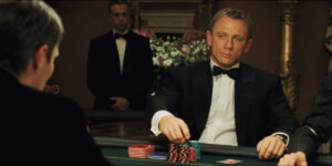 Daniel Craig prepares to nonchalantly toss some poker chips at the table in Casino Royale.